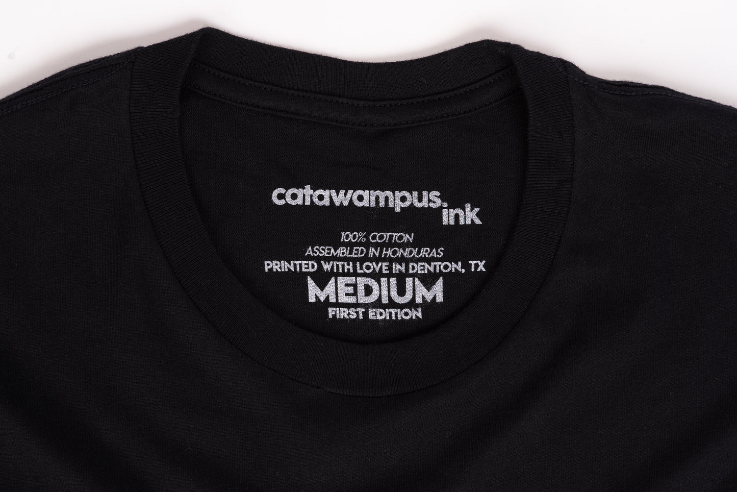 A close up image of the Catawampus Ink printed tag.